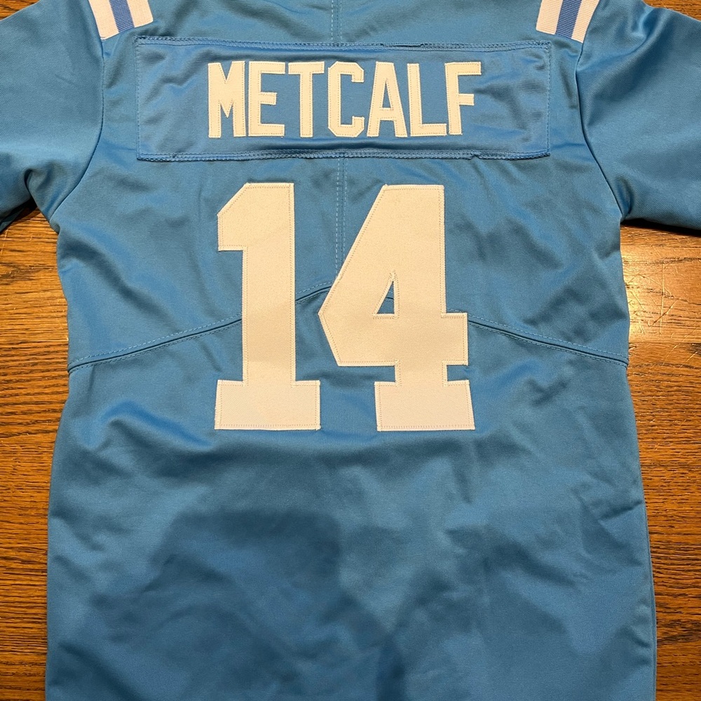 Youth football jersey.  Ole Miss DK Metcalf sized M.